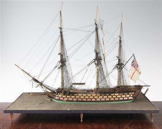 An early 19th century cased model of a Man-O-War, 18 x 21ins